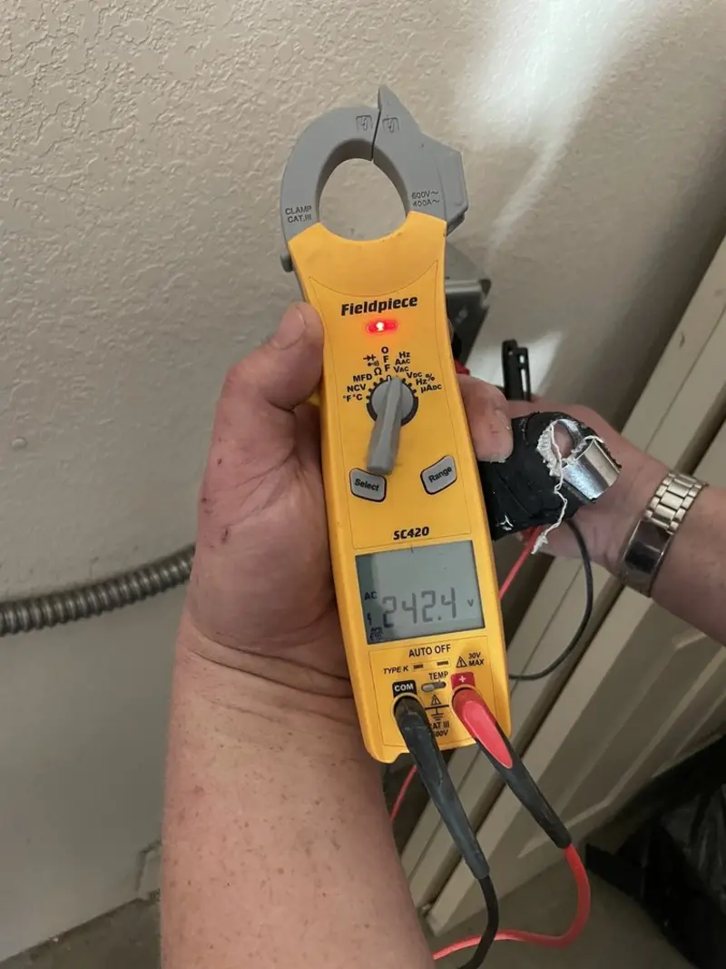 Voltage testing with clamp meter during Circuit Breaker Repair in Lubbock
